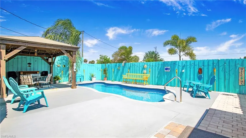 View of pool featuring a fenced backyard, a fenced in pool, a gazebo, and a patio area