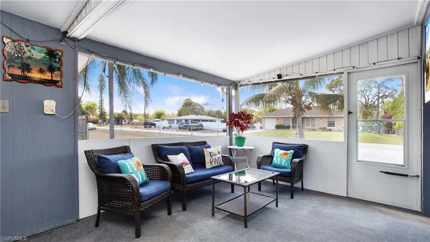 Sunroom featuring an outdoor living space