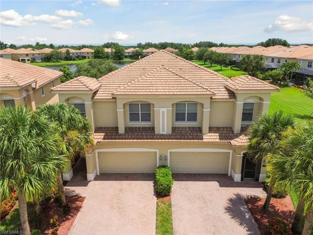 Mediterranean / spanish-style home with a garage