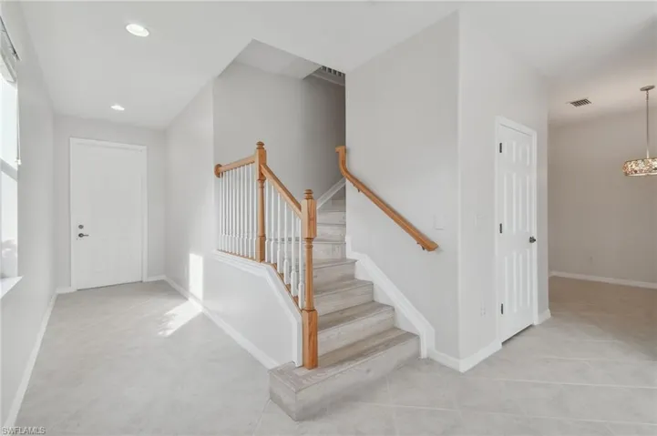 Entryway featuring light tile patterned flooring
