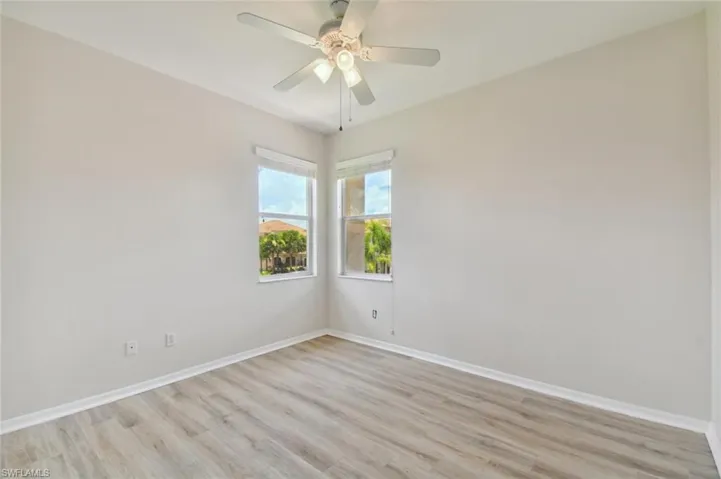 Spare room with light hardwood / wood-style floors and ceiling fan