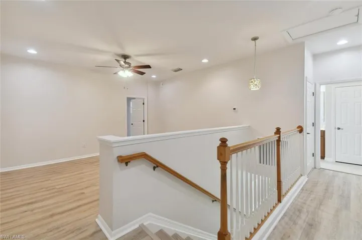 Hallway featuring light hardwood / wood-style flooring