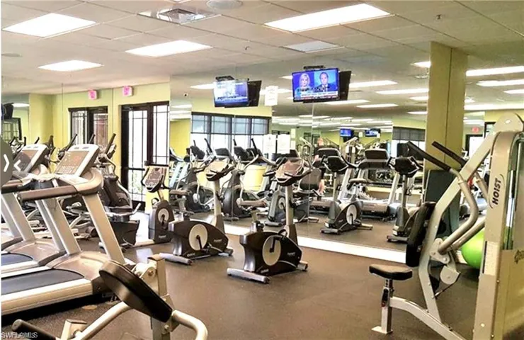 Gym with a paneled ceiling