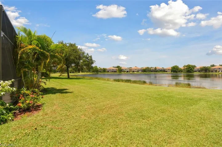 View of yard with a water view
