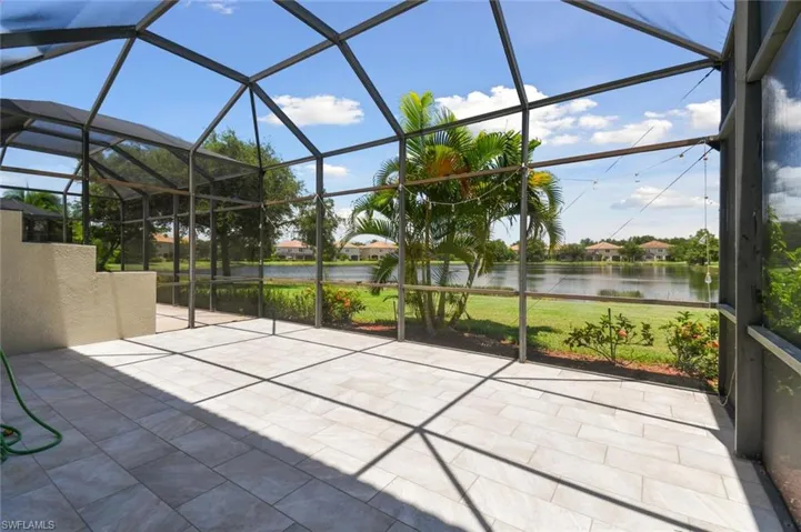 Unfurnished sunroom with a water view