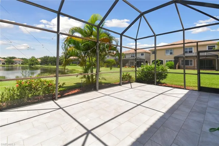 Unfurnished sunroom featuring a water view