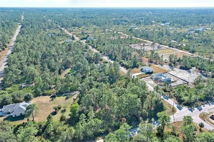 Aerial overview of property's location featuring a forest