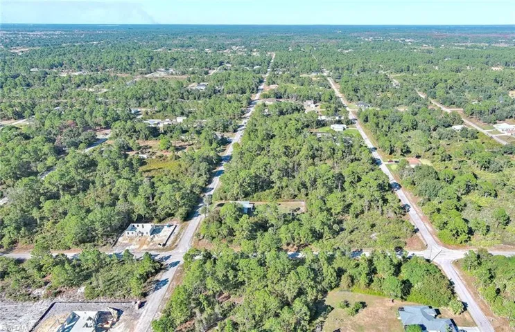 View of property location featuring a heavily wooded area
