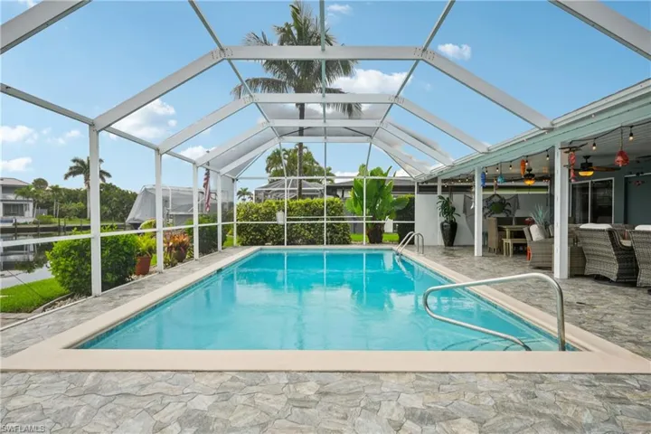 Swimming pool with a patio area and ceiling fan