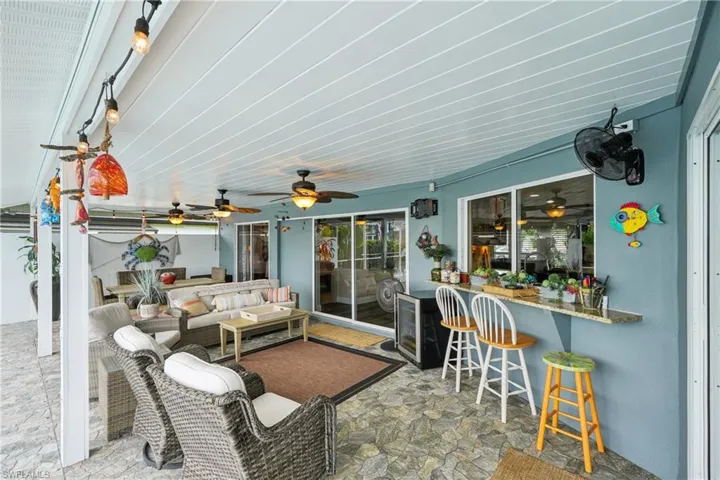 View of patio / terrace featuring an outdoor living space and a ceiling fan
