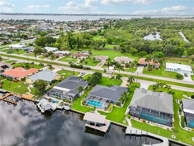 Aerial perspective of suburban area with a nearby body of water