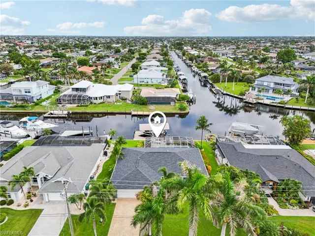 Aerial perspective of suburban area with a large body of water