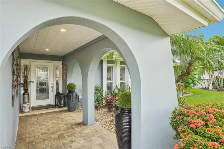 Entrance to property with stucco siding