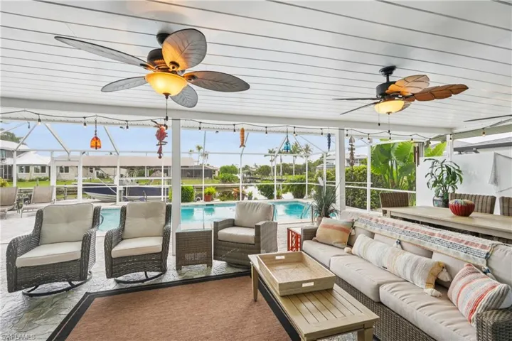 Sunroom / solarium with an outdoor living space and a ceiling fan