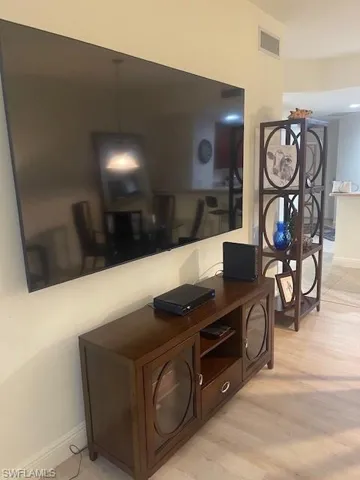 Detailed view of wood finished floors and baseboards