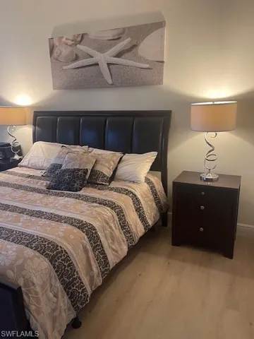 Bedroom with light wood-style floors