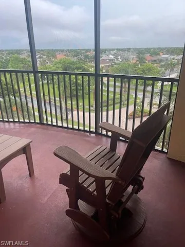 Balcony featuring a sunroom