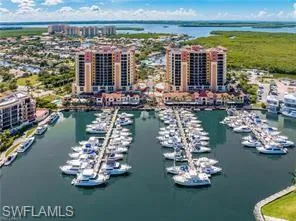 Birds eye view of property featuring a water view and a city view