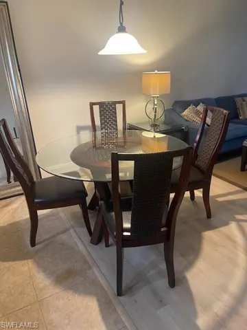 Dining room with light tile patterned flooring
