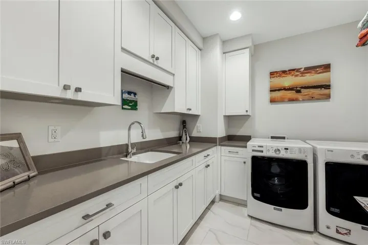 Large laundry with plenty of storage space.