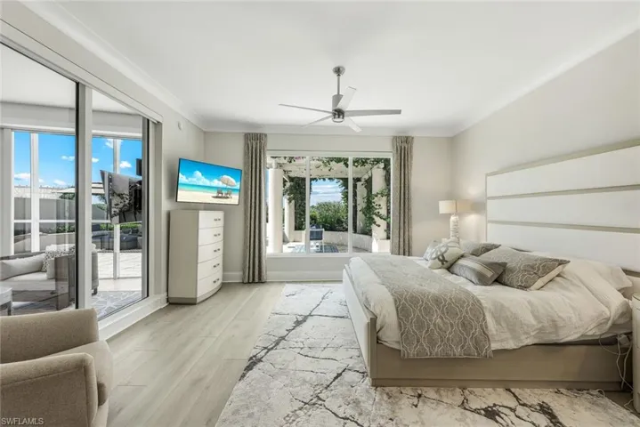 Following a day at the beach club or on the golf course, this lovely primary suite is whereyou will happily "recharge."