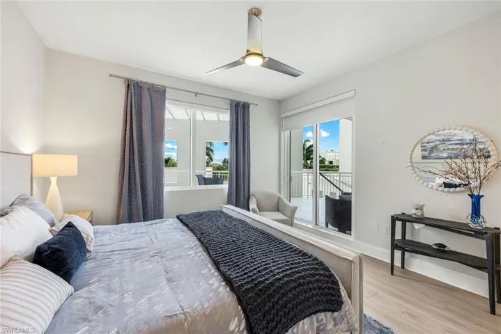 Guest suite on opposite side of the home from primary with a HUGE balcony and soft morning light.