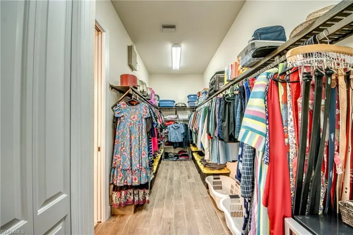 Walk in closet featuring light wood-type flooring