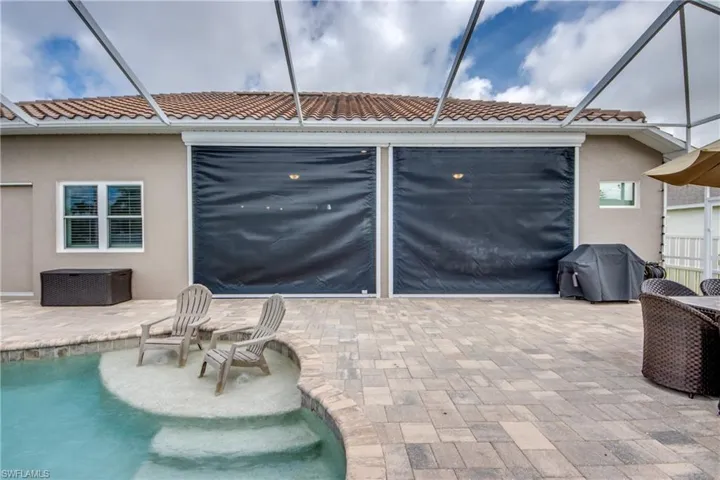 View of patio / terrace featuring a pool, area for grilling, and a lanai