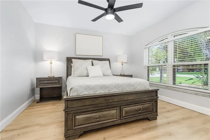 Bedroom featuring ceiling fan and light wood-type flooring