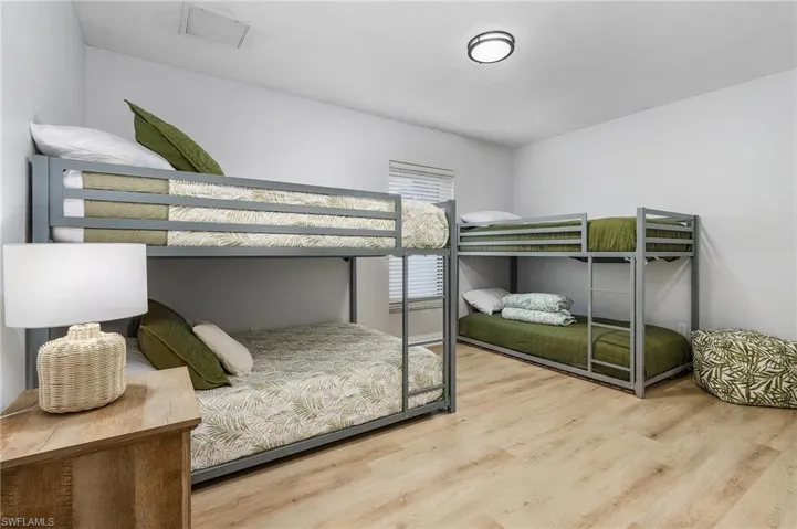 Bedroom with hardwood / wood-style floors