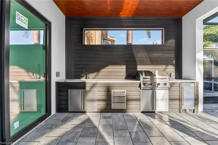 View of patio / terrace with area for grilling and a sink