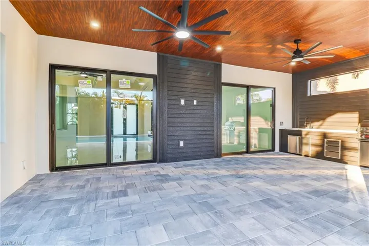 View of patio featuring ceiling fan and exterior kitchen