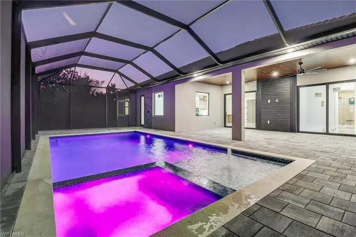 Relaxing pool / spa , a patio, and a lanai