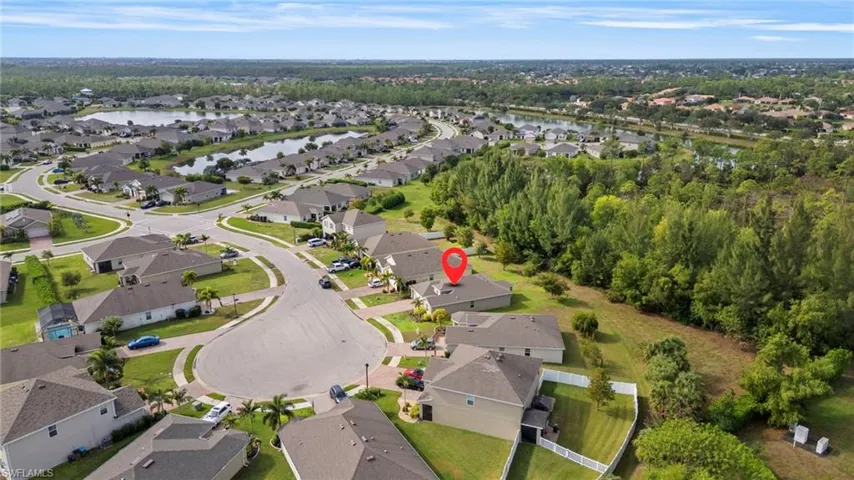 View of property location with nearby suburban area