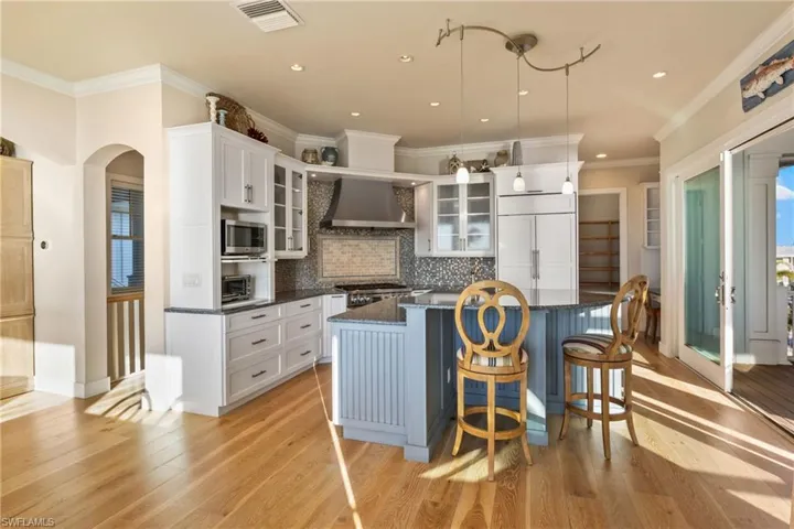 Kitchen island is perfect to gather around - there is a large walk in pantry and additional desk seating!  The elevator makes it very easy to bring up groceries and supplies!