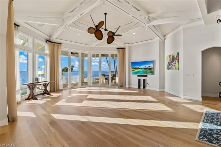 Another view of the great room and the magnificent views - the 10 foot Andersen Hurricane Impact doors open fully to extend the indoor and outdoor living space with two patios to enjoy the million dollar sunsets!