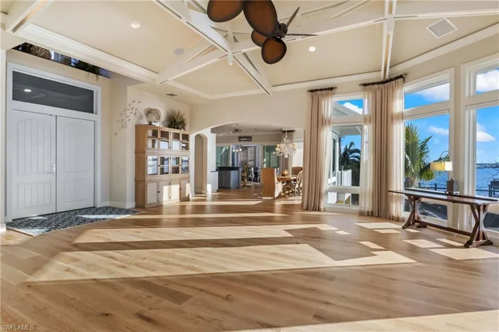 Abundant natural light floods this home - ceilings are Caribbean vaulted with lighting in the designer wood trim!