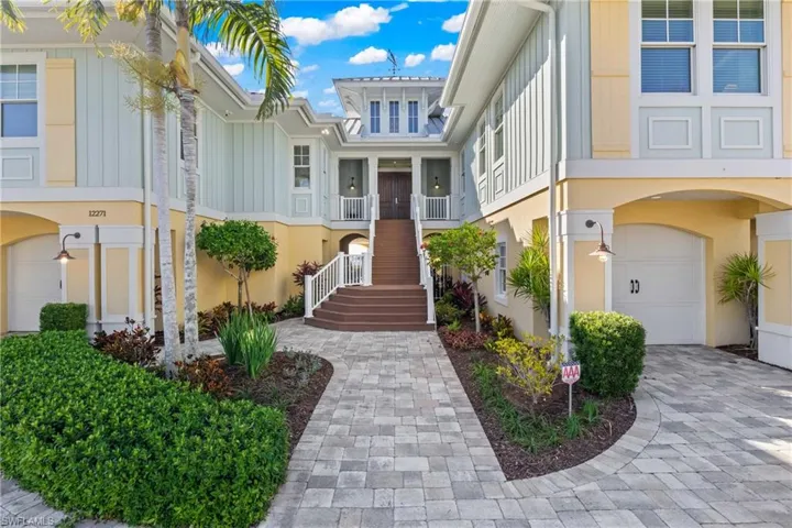 The entry to this home is so inviting and the details are everywhere - weather vane on the rooftop, metal roof, trex deck stairs, designer korbels - this has it all!