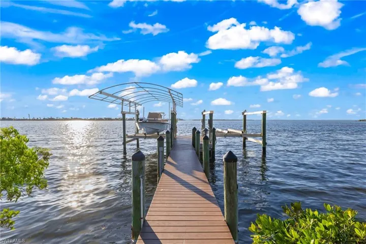 Why settle for one boat lift when you can have two?  Perfectly positioned to jump on and go enjoy the fishing and waters of this incredible area!
