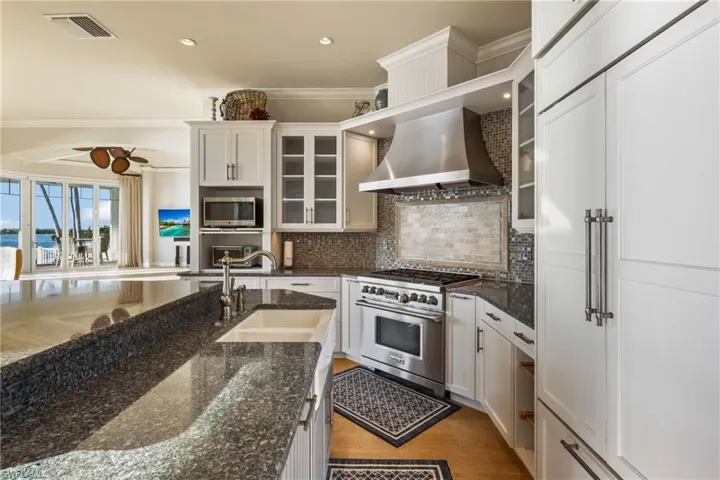 Lots of thoughtful upgrades including appliance cabinet, double sinks and a generous amount of cabinets and storage!