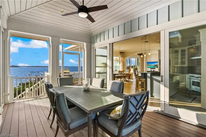 Screened in out door al fresco dining area directly off the kitchen - a GREAT way to host parties or eat outside and enjoy the magnificent views!