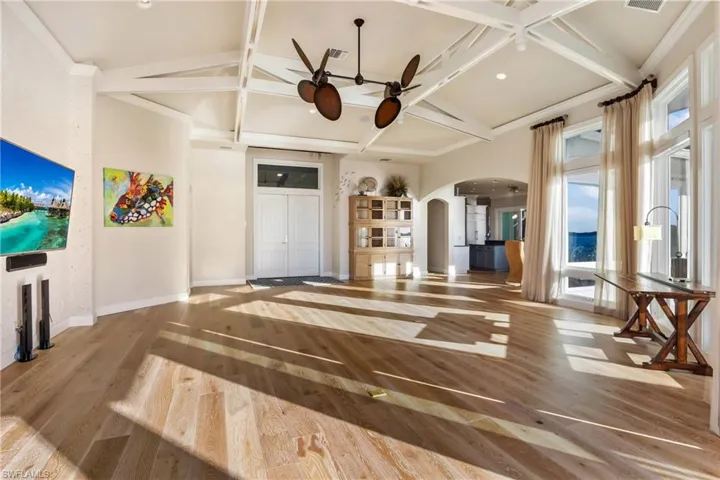 Double door foyer entry into the spacious great room with open concept living to enjoy the best of the SWFL lifestyle!