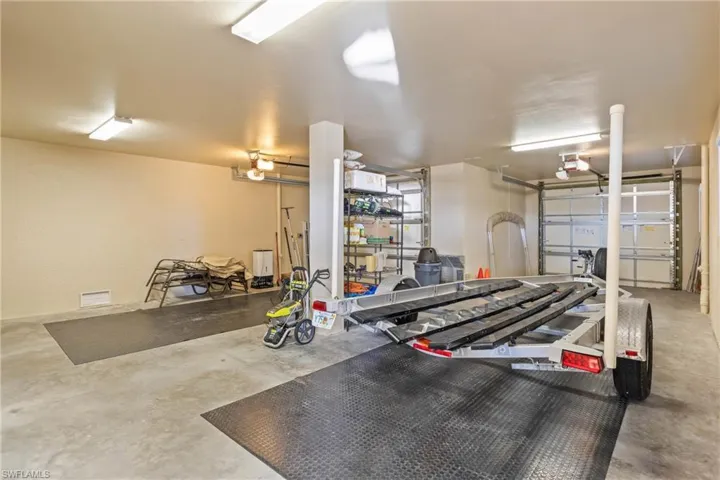 This is the three car garage - one side is double deep in order to hold a boat trailer.  There is also an additional separate garage for a total of four!