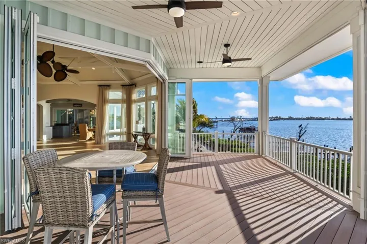 Panoramic view from the upstairs patios - custom folding hurricane impact doors retreat to allow a wide open expansion of the indoor and outdoor living spaces!