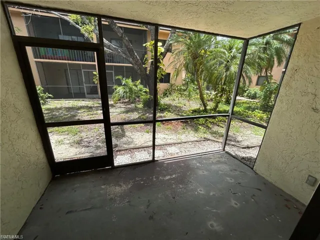 Detailed view of a textured wall and unfinished concrete flooring