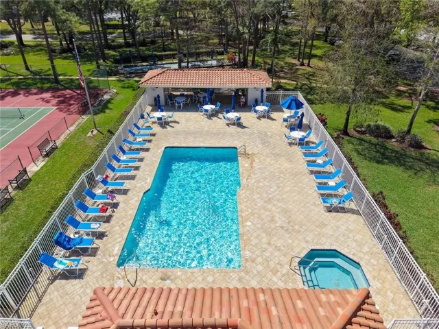 Community pool featuring a patio