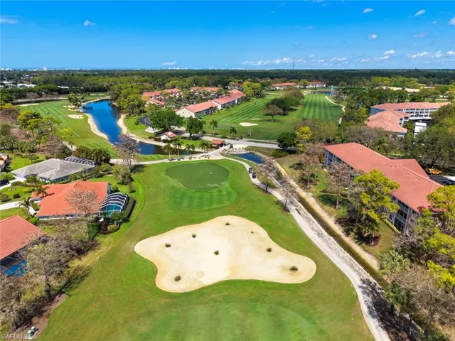 Aerial view of a local golf course and a nearby body of water