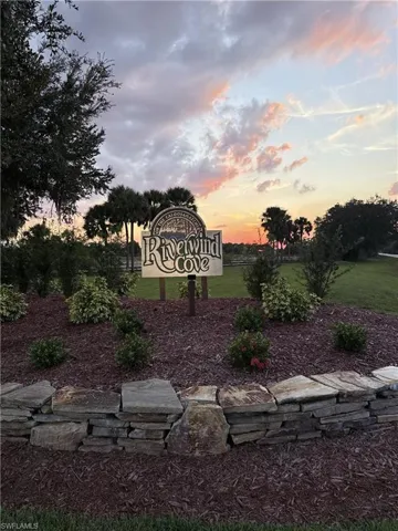 Community / neighborhood sign with a lawn