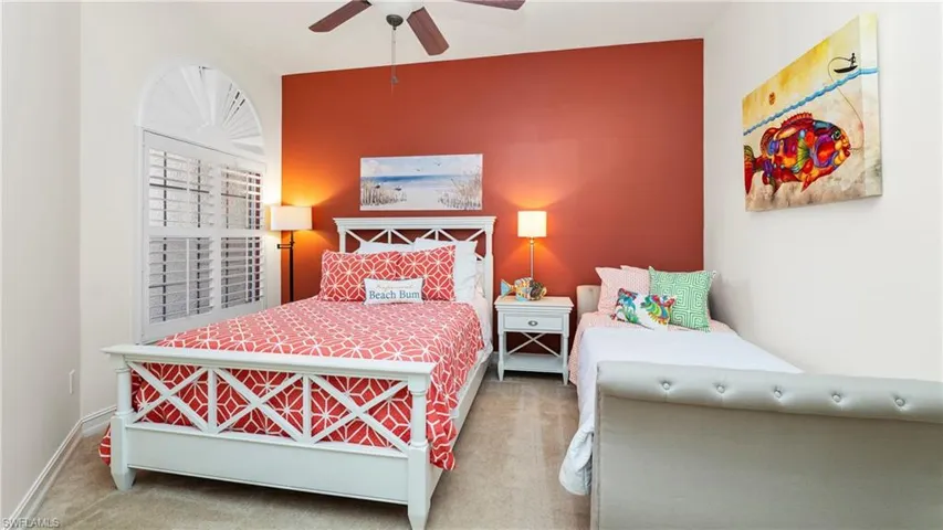 3rd Bedroom featuring a ceiling fan, carpet flooring, and an accent wall