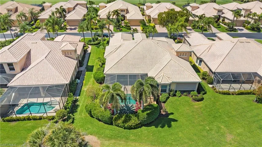 Aerial perspective of suburban area with a pool area